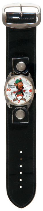 "ELDRIDGE CLEAVER" HOLDING MACHINE GUN AND GIVING "BIRD" C. 1968 WATCH BY DIRTY TIME CO.