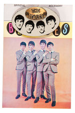"THE BEATLES" LEATHER & BRASS PIN ON CARD.