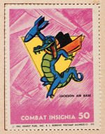 "COMBAT INSIGNIA/WAR INSIGNIA" STAMP ALBUM TRIO FEATURING DISNEY STUDIO DESIGNS.