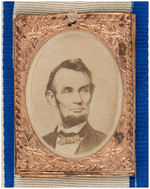 LINCOLN 1864 CARDBOARD PHOTO BADGE ON PAIR OF ORIGINAL RIBBONS.