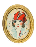 BRASS OVAL PIN  WITH GORGEOUS CELLULOID DEPICTION OF 1920s STYLISH WOMAN.