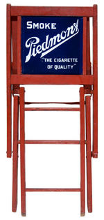 “SMOKE PIEDMONT/THE CIGARETTE OF QUALITY” PORCELAIN BACKED FOLDING CHAIR.