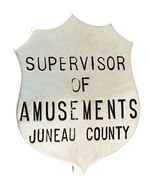 "SUPERVISOR OF AMUSEMENTS JUNEAU COUNTY" NICKEL PLATED BADGE.