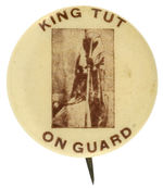 “KING TUT ON GUARD” CIRCA 1920s TOMB OPENING BUTTON FROM HAKE COLLECTION AND CPB.