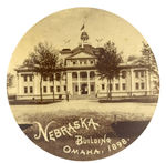 “NEBRASKA BUILDING OMAHA, 1898” REAL PHOTO BUTTON.