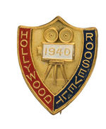 "HOLLYWOOD ROOSEVELT 1940" BRASS PIN SHOWING 35MM MOVIE CAMERA.