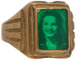 RARE BRASS RING WITH WOMAN'S PHOTO BENEATH GREEN CELLULOID COVERING.