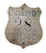 "LINDBERGH 28 POLICE" BRASS BADGE.