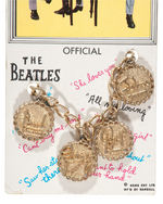 “THE BEATLES” CHARMS/HEART VARIETY PAIR OF CARDED BRACELETS.