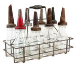 LOT OF 12 GENERIC OIL BOTTLES WITH TWO CARRIERS.