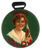 “DRINK GAY-OLA” CELLULOID COVERED MIRROR WITH METAL FLANGE FOR WATCH FOB STRAP ATTACHMENT.