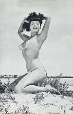 BETTIE PAGE PHOTOGRAPHER BUNNY YEAGER SIGNED CONTRACT & 1957 PIN-UP BOOK.