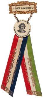 OUTSTANDING 1910 COLUMBUS DAY RIBBON BADGE.