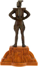 "THE ROCKETEER" BRONZE STATUE ON ART DECO BASE BY KENT MELTON.