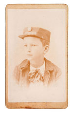 CARDBOARD PHOTO WITH YOUNG BOY WEARING "CLEVELAND & STEVENSON" HAT.