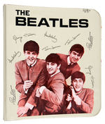 "THE BEATLES" THREE RING BINDER IN IVORY.