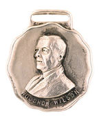 "WOODROW WILSON" HIGH RELIEF SILVERED BRASS SHELL FOB.