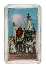 "CONEY ISLAND/LUNA PARK” PAPERWEIGHT TRIO AND THREE SPOONS AND FORK.