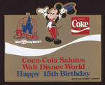 "WALT DISNEY WORLD" & "COCA-COLA" BOXED 15TH ANNIVERSARY FRAMED PIN SET.