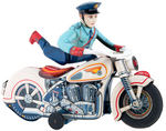 BATTERY OPERATED POLICEMAN ON MOTORCYCLE.