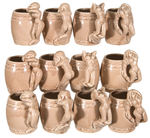 FULL CASE OF 12 GLAZED CERAMIC FIGURAL PIN-UP MINIATURE MUGS.