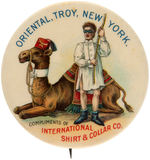"INTERNATIONAL SHIRT & COLLAR CO." AD BUTTON WITH BIZARRE RITUAL SCENE AND GREAT COLOR.