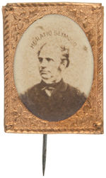 "HORATIO SEYMOUR" CARDBOARD PHOTO IN BRASS SHELL FRAME WITH STICKPIN.