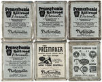 PENNSYLVANIA RAILROAD BADGE COLLECTION PLUS SIX "PHOTOMATIC" SOUVENIRS.