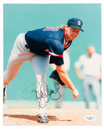“ROGER CLEMENS” SIGNED BASEBALL AND PHOTO.
