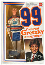 WAYNE GRETZKY BOXED ACTION FIGURE AND SIGNED PROMO PHOTO.