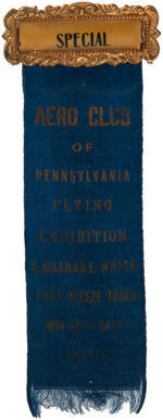 HISTORIC RIBBON BADGE FOR 1910 AVIATION SHOW NAMING PIONEER CLAUDE GRAHAME-WHITE.