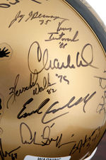 HEISMAN TROPHY WINNERS MULTI-SIGNED LIMITED EDITION FOOTBALL HELMET DISPLAY.