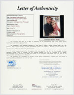 "I DREAM OF JEANNIE" BARBARA EDEN & LARRY HAGMAN SIGNED PHOTO & EDEN SIGNED CHECK.