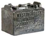 WESTINGHOUSE BATTERY/TRYON’S GARAGE FIGURAL PAPERWEIGHT.