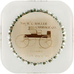 "THE W. C. KOLLER CARRIAGE CO." GLASS PAPERWEIGHT.