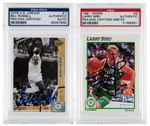 BILL RUSSELL & LARRY BIRD SIGNED BASKETBALL CARD PAIR.