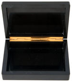 CARVED BLACK ONYX BOX WITH INLAID RUBIES IN LID.