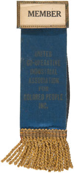 SCARCE "UNITED CO-OPERATIVE INDUSTRIAL ASSOCIATION FOR COLORED PEOPLE INC" RIBBON BADGE.