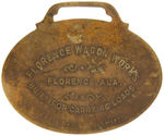 FARM WAGON BRASS WATCH FOB AND LARGE CELLULOID STOCKYARD FOB.