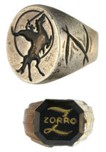 WALT DISNEY’S ZORRO PAIR OF RINGS AND CHARM BRACELET.