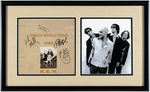 R.E.M. BAND-SIGNED "GREEN WORLD TOUR 1989" FRAMED DISPLAY.