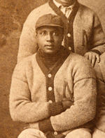 "1907 MANITOWOC" BASEBALL TEAM REAL PHOTO POSTCARD W/NEGRO LEAGUE STAR GEORGE WILSON.