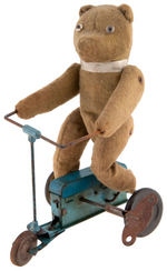 EARLY WIND-UP TEDDY BEAR TRICYCLE.