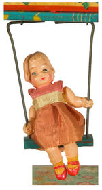 “SWING TIME” BOXED VARIETY WINDUP CLOCK WITH GIRL.