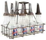 “HUFFMAN” COLOR VARIETIES LOT OF SEVEN OIL BOTTLES WITH CARRIER.