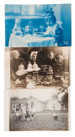 DOLLS AND TOYS IN LOT OF NINE REAL PHOTO POSTCARDS.