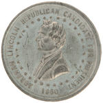 LINCOLN 1860 TOKEN WITH AERIAL VIEW OF SPLIT RAIL FENCE ACCENTED BY ROOSTERS, BIRDS AND SQUIRREL.