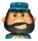 BLUTO FIGURAL STRING HOLDER.