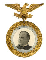 McKINLEY STRIKING AND SYMBOLIC LARGE BADGE IN GOLD AND SILVER LUSTER.