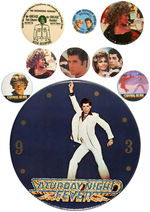 JOHN TRAVOLTA GROUP OF EIGHT BUTTONS PLUS GIGANTIC BUTTON-LIKE 9” CLOCK FACE.